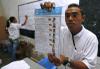 An East Timorese electoral worker inspects ballots